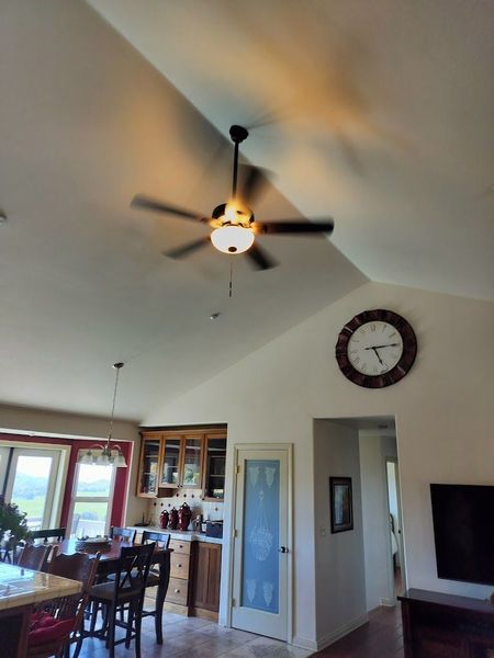 Ceiling fan on tall ceiling.